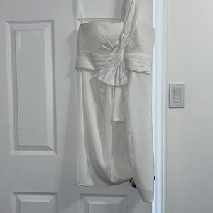 delicate dress that has been worn twice for events. The quality is incredible